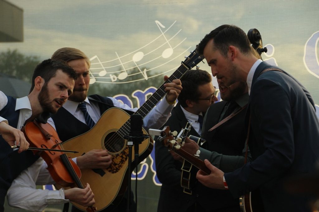 Strengplukk performing at the Strenger i Gress Bluegrasscamp Vikersund, Norway July 2019. From left to right - Nikolai Storevik, Jakob Folke Ossum, Vidar Starheimsæter, Andreas Barsnes Onarheim, and Thor. Photo by Hans Kelderhuis.